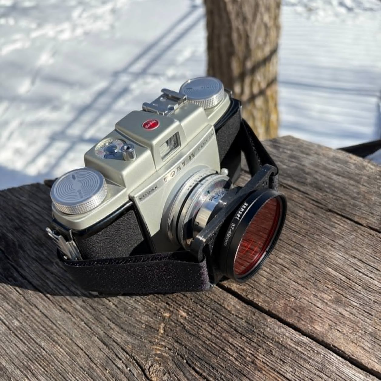 Installed with strap onto a Kodak folding camera